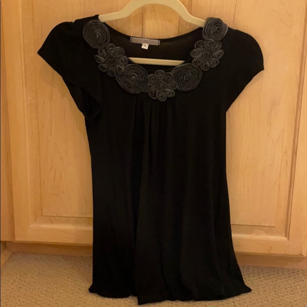 Black shirt with flower details